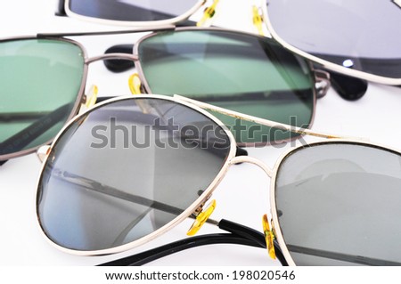 Collection of sunglasses on white background