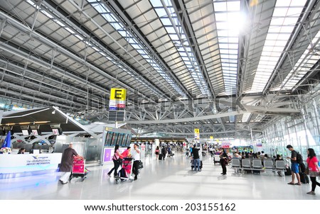 BANGKOK JULY 1. People waiting in check-in line E terminal of the Bangkok airport on July 1, 2014. Suvarnabhumi airport is world\'s 4th largest single-building airport terminal.