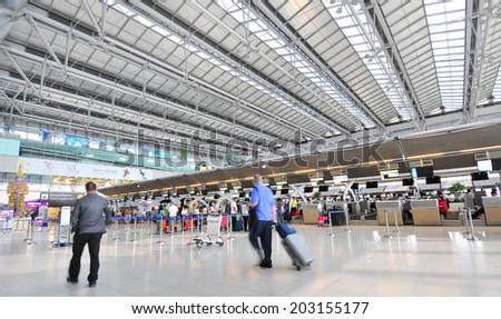 BANGKOK JULY 1. People waiting in check-in line G terminal of the Bangkok airport on July 1, 2014. Suvarnabhumi airport is world\'s 4th largest single-building airport terminal.