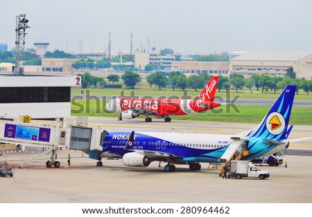 BANGKOK - April 27: Commercial aircraft wait for taking off at Don Mueang international airport on April 27, 2015 in Bangkok, Thailand. This airport is the hub of low cost airlines in Bangkok.