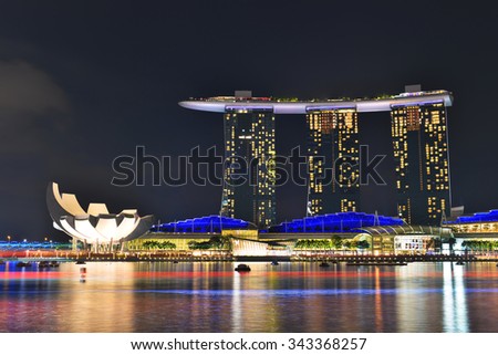 SINGAPORE, SINGAPORE -November 17,2015: Singapore city lights, ArtScience Museum, Marina Bay Sands and Helix Bridge at night, Singapore