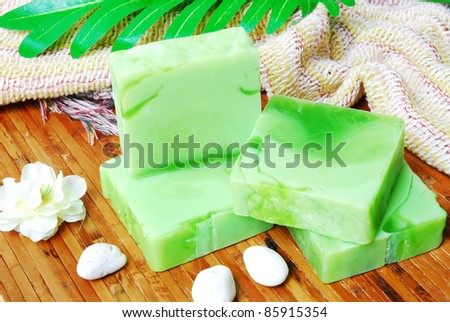Handmade soap bars on Bamboo mat with Jasmine flowers and leaf