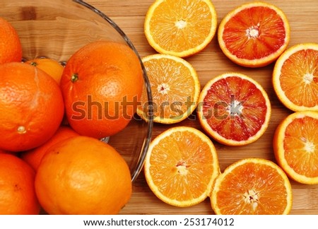 Organic oranges on a wooden board