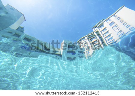 see the building from swimming pool under water