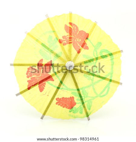 yellow cocktail umbrella isolated on white background