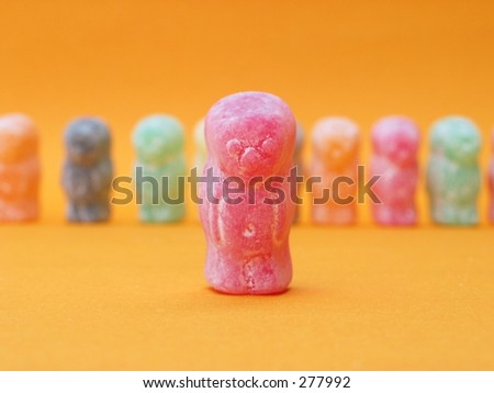 one jelly babies standing out from the crowd the background is out of focus.
