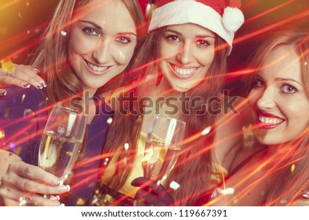 Three beautiful girls on the New Year\'s Eve