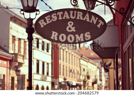Restaurant and rooms signboard at the entrance of an Europe hotel
