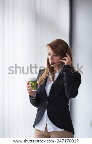 Call center operator having a conversation with a client