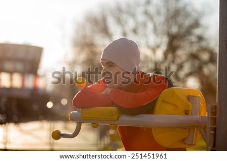 Athlete preparing for a training in an outdoor gym. Soft focus