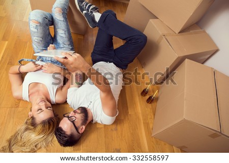 Young couple in love moving in a new flat