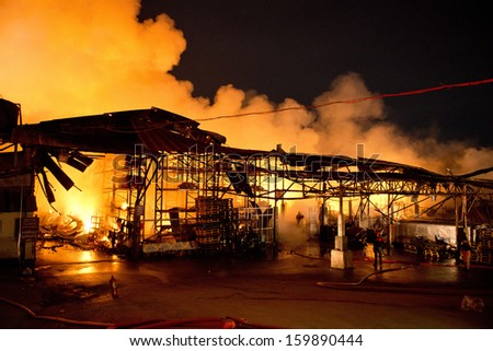 Phuket, THAILAND OCT 16: Fire in Superstore - catch fire in Super Cheap (Big Superstore in Phuket) Substantial damage on October 16, 2013 in Phuket, Thailand