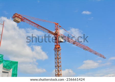 The red crane working for construction, building