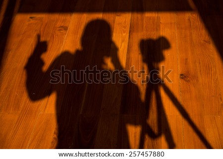 shadow of photographer on the floor, wooden