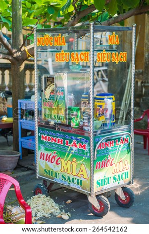 Hoi An - Vietnam Mar 16 ::  Molasses from fresh sugarcane Mobile food shop in Hoi An ancient town on Mar 16, 2015 Vietnam