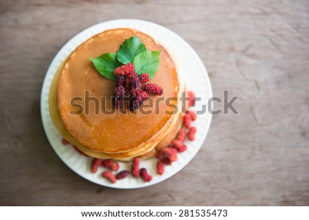 Delicious pancakes with fresh mulberry and honey, dessert