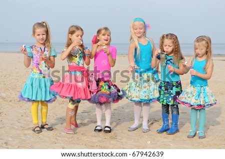 stock photo Young girls playing on the beach