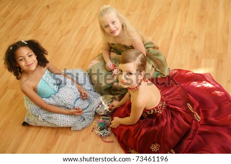 Little girls playing dress up