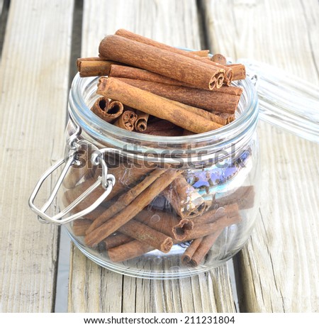 Cinnamon spice scented brown tasty on the table in a glass jar.