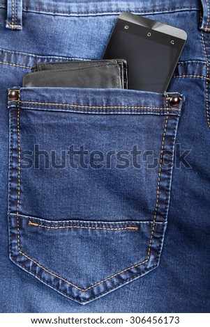 Blue jeans with wallet and smart phone in pocket