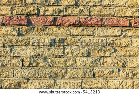 Brick wall, colored rough blocks  background