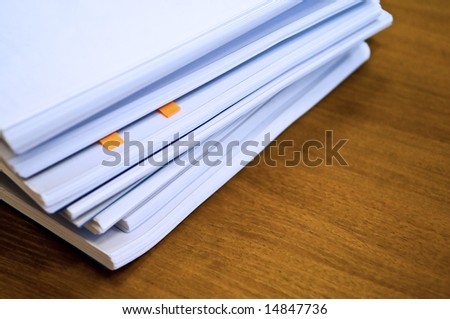 heap of documents on table