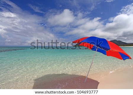 The beach and the beach umbrella of midsummer.