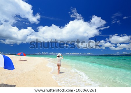 A pretty happy young woman enjoying at a beach