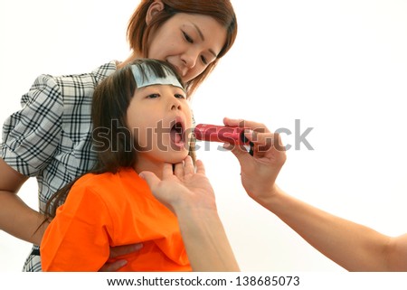 Child having physical examination