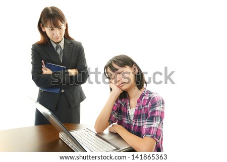 Girl studying at the desk being tired