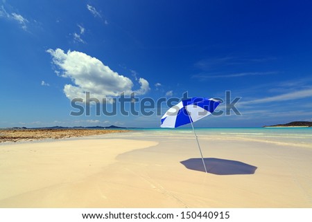The beach and the beach umbrella of midsummer The beach and the beach umbrella of midsummer