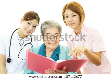 Senior woman with medical staff