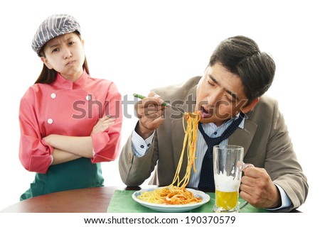 Asian waitress with customer