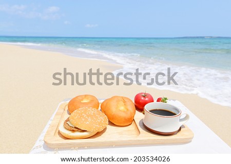 Coffee and  fruits on the sandy beach