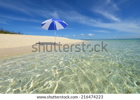 The beach and the beach umbrella of midsummer.