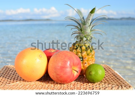 Tropical fruits on the sandy beach