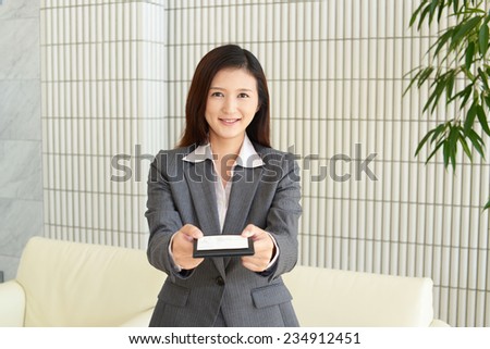 Smiling woman with business card