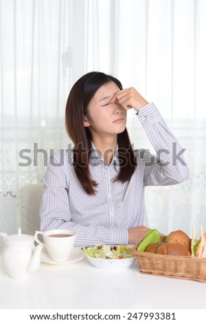 Woman is having bad headache