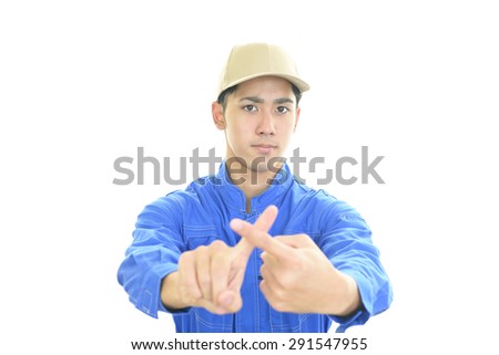 Asian worker shows the sign of prohibition