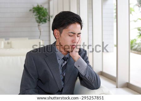 Disappointed Asian businessman