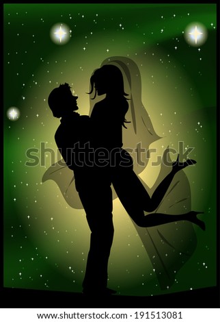 Silhouette of bride and groom on the background of the beautiful starry sky