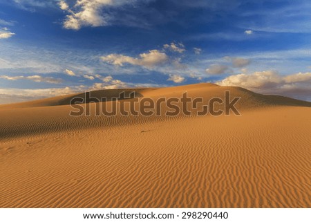 Desert landscape on the background of clouds. The Gobi Desert. Mongolia.