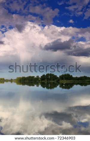 Reflection of rain clouds in the lake