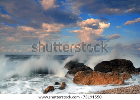 Stormy sunset on the ocean shore