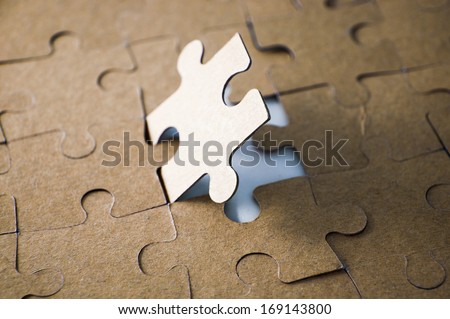 Last piece of jigsaw puzzle - golden tone