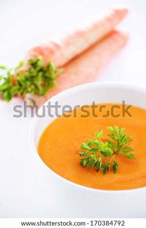 Carrots soup on white background