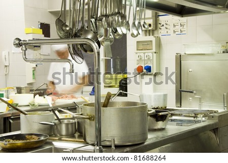 Chef preparing food  in kitchen restaurant