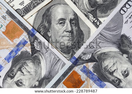 One hundred dollars close-up. Detail of hundred-dollar bills.