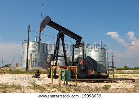 onshore oil production well, nodding donkey, with storage facilities