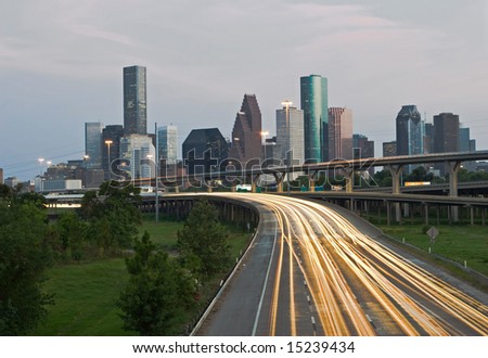 Rush-hour Traffic on highway exiting the city of Houston in the evening